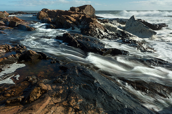 Waves rushing through rocks