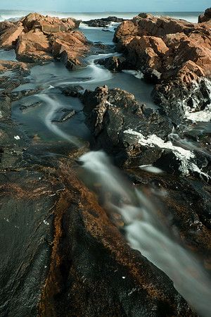 Waves rushing through rocks